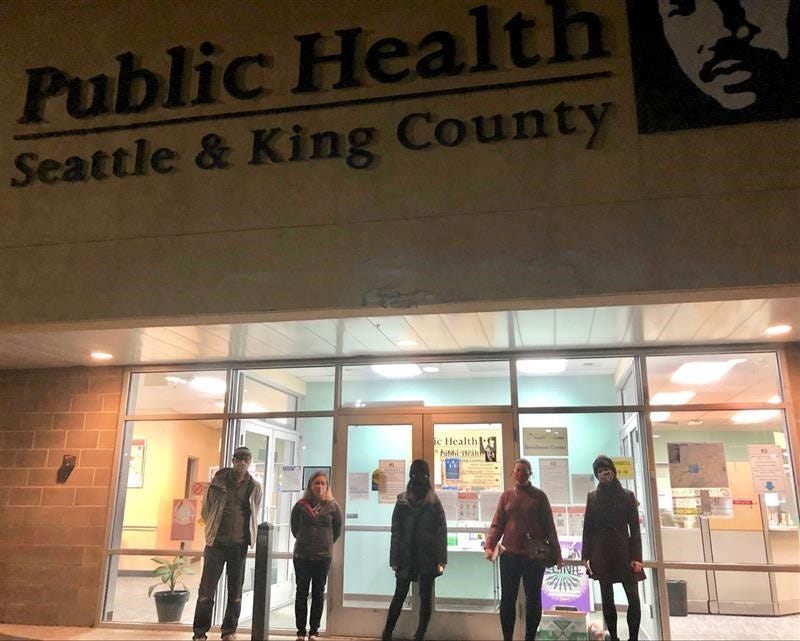 VillageReach volunteers Chongsun Ahn, Trisha Patek, Mi Le, Christine Lenihan, Sierra Petrosky standing outside a Seattle-King County Public Health Clinic from where they transport vaccines to high volume sites on a daily basis.