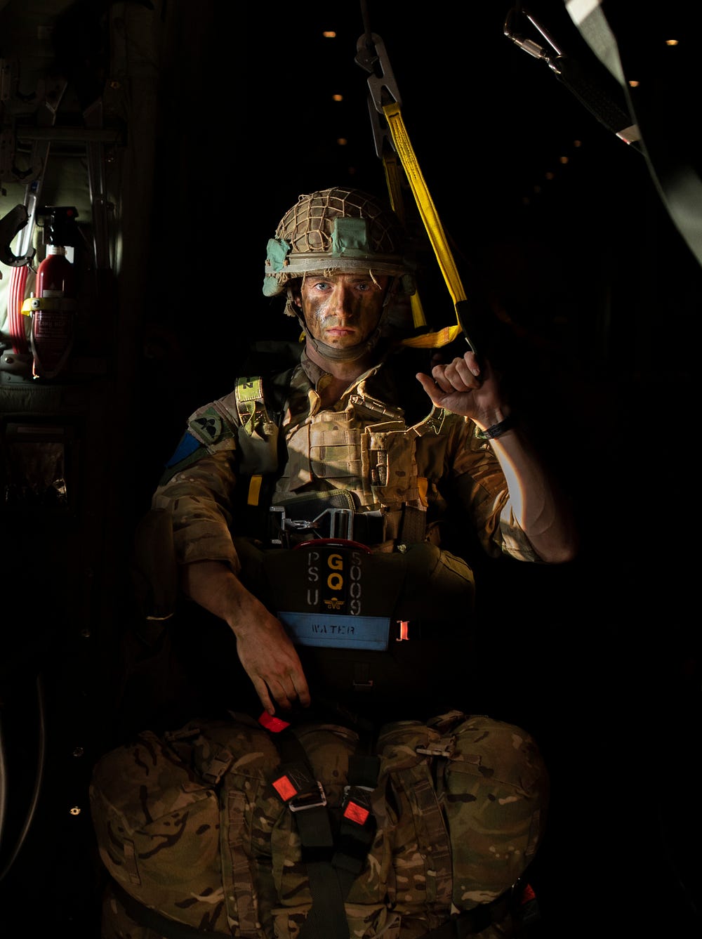 A paratrooper 16 Air Assault Brigade prepares to jump from a C130 Aircraft and parachute into Ukraine.