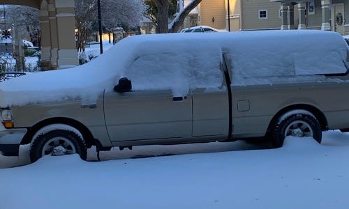 Unusual picture of a snow covered vehicle in Austin, Texas