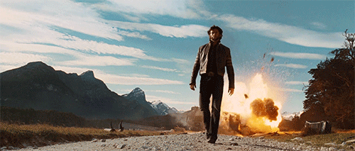 man walking away from an explosion