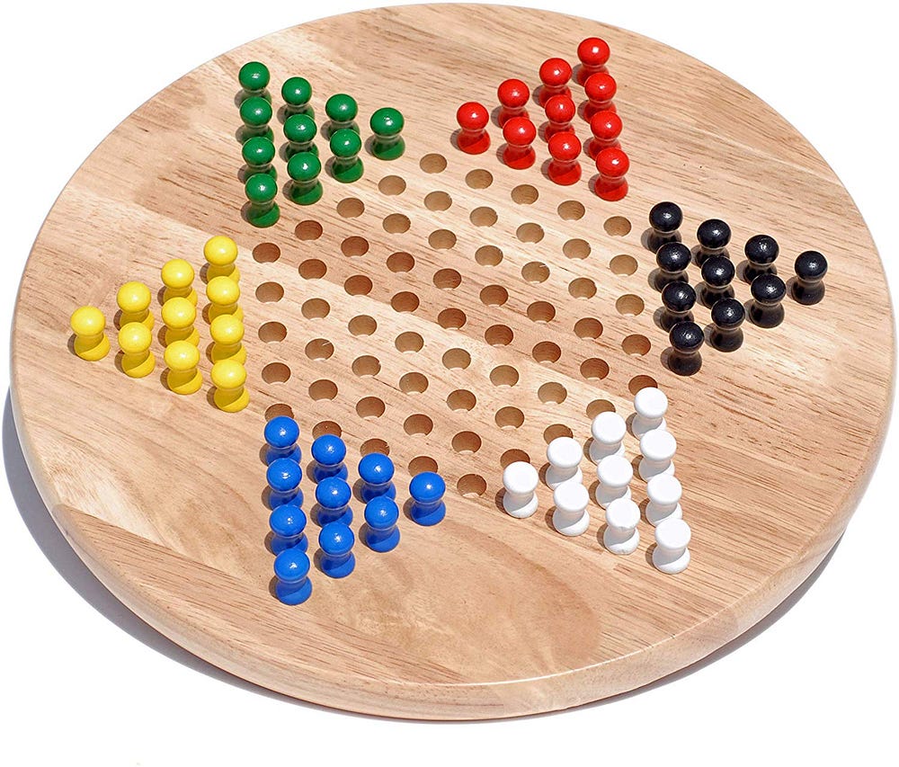 A Dance With Chinese Checkers. Two rookies, one wooden game board, and ...