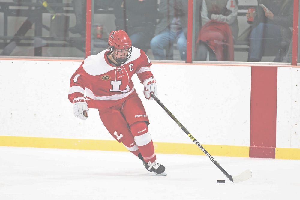 Female ice hockey player makes a breakaway by Kelly Flynn The