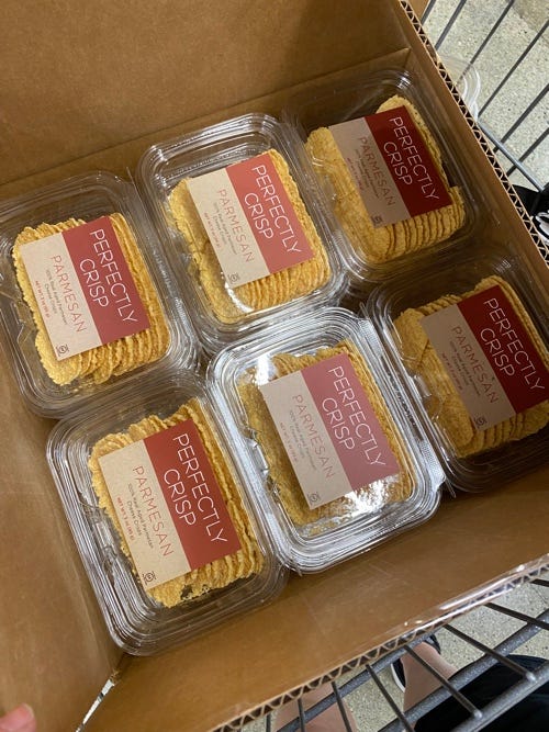 cardboard box full of perfectly crisp brand parmesan crisps