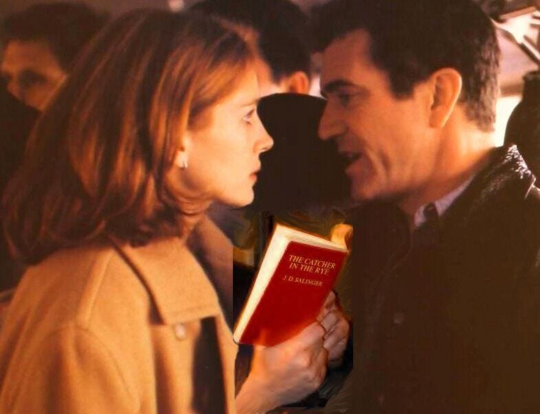 A frame of the film ‘Conspiracy Theory’ showing Mel Gibson’s character talking to a woman holding a cop of ‘Catcher in the Rye’