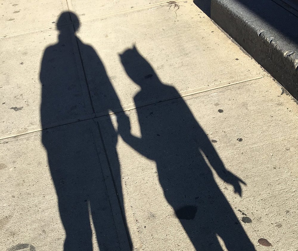 Mother and daughter in shadow