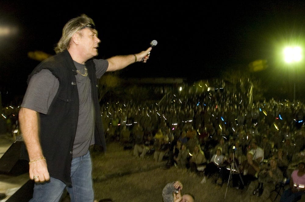 Brian Howe, former Bad Company Frontman gets the audience involved in the rock show (Baghdad, 2010, entertaining U.S. Troops)