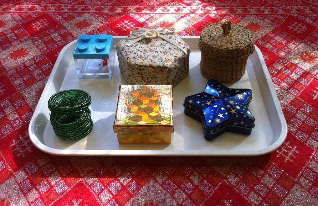 Opening & closing boxes. The child matches lids to boxes, whilst… by