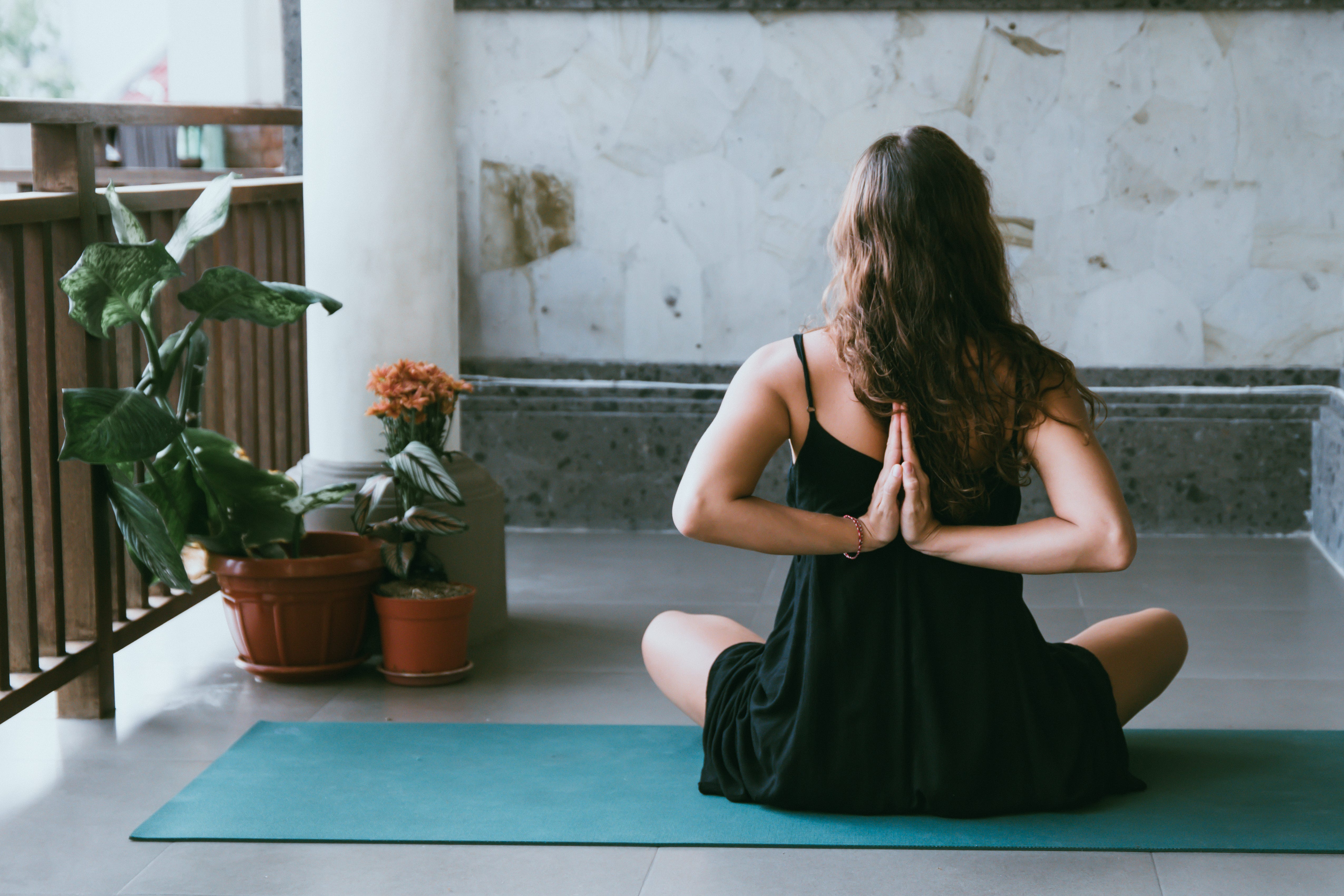 Women doing reverse prayer yoga pose
