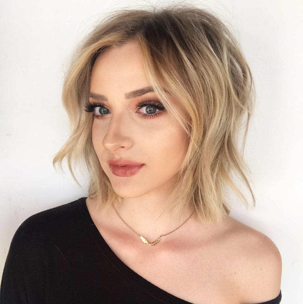 Golden Undone Shaggy Bob With Curtain Bangs And Soft Wavy Texture