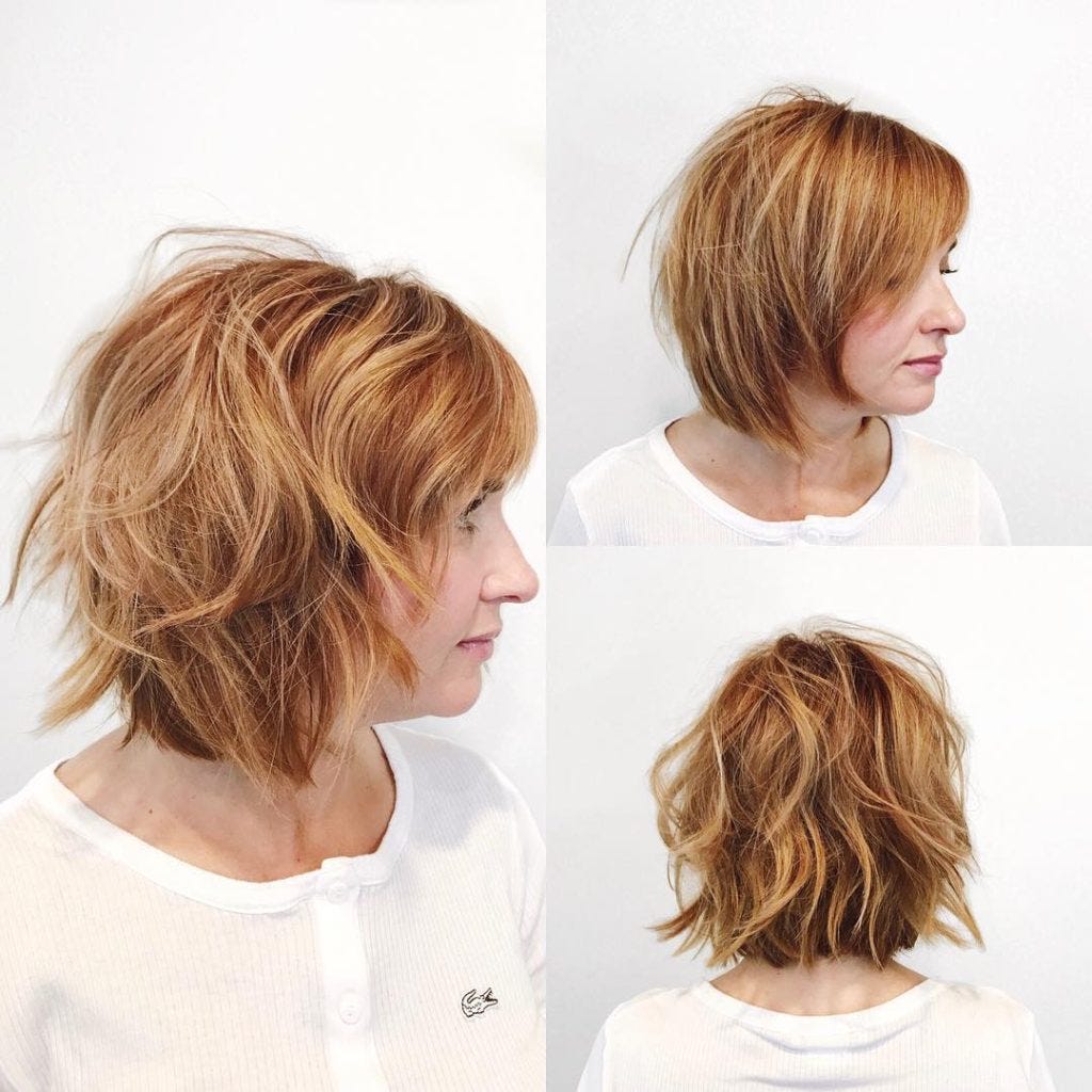 Undone Razor Cut Bob With Side Swept Bangs And Light Auburn Color