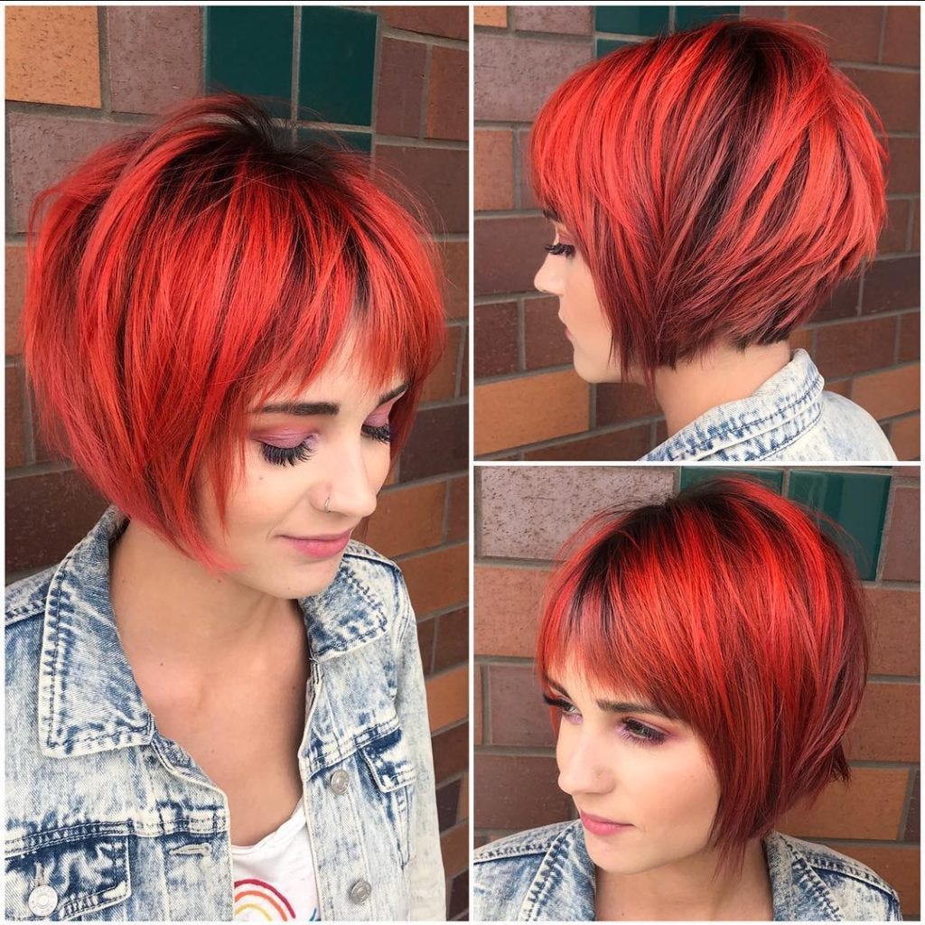 “Choppy Red Graduated Bob with Fringe Bangs and Black Shadow Roots” is publ...