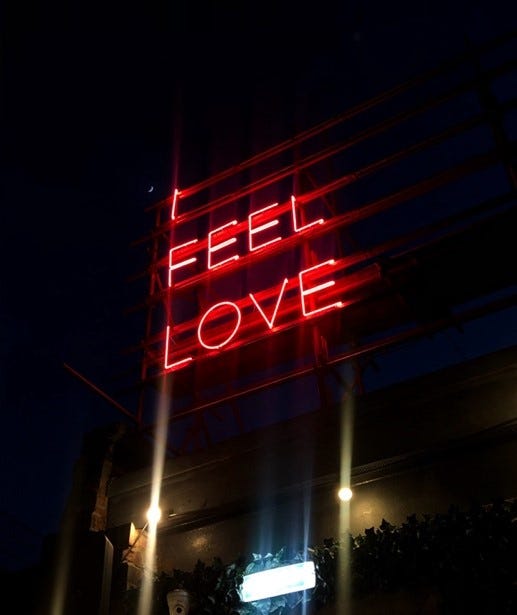 A neon sign at Headrow House reads ‘I feel love’.