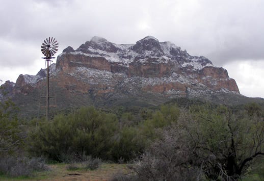 A large snowy cliff hangs over the Oak Flat campground.