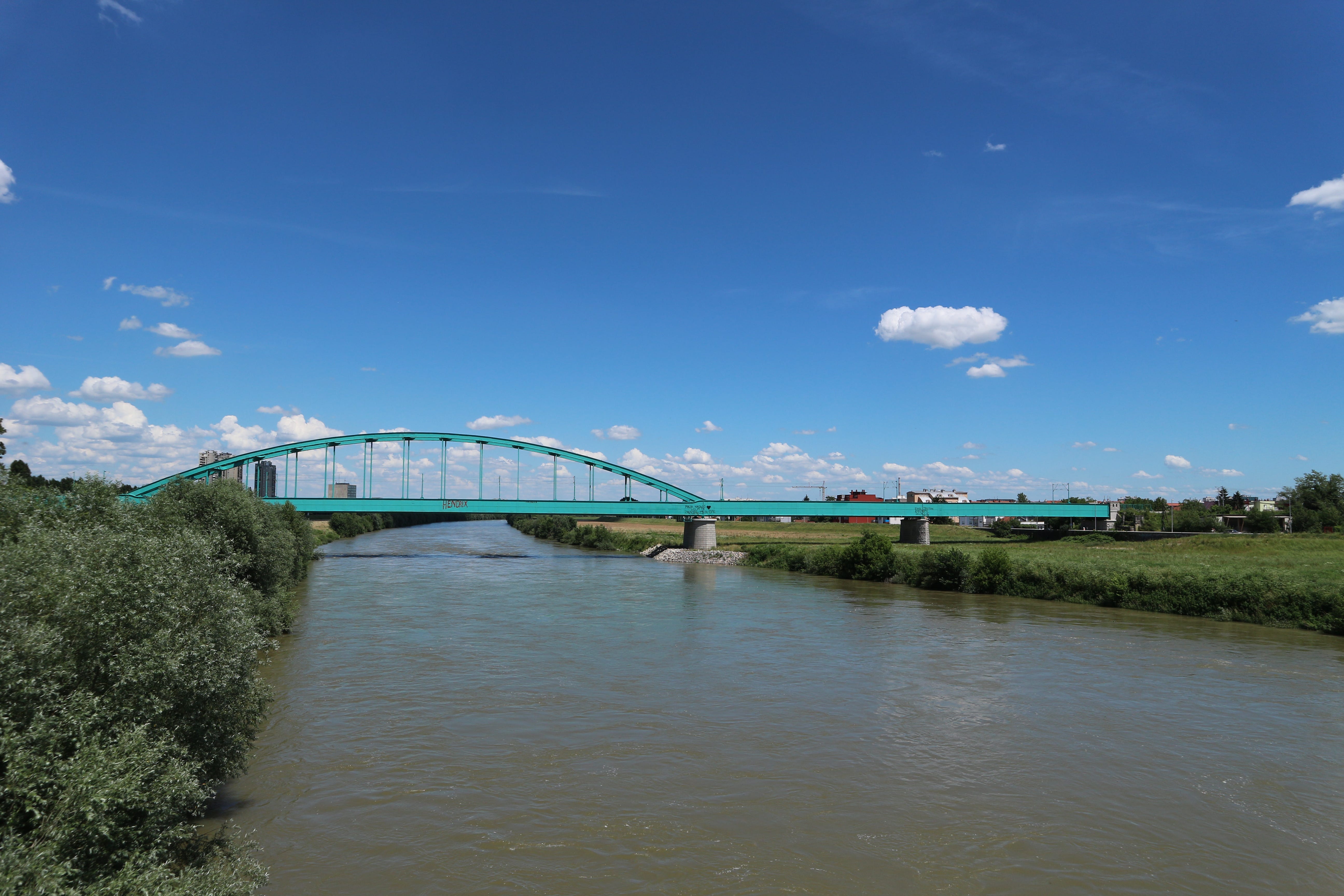 iconic HENDRIX tag on the bridge crossing the river sava, very brown in this photograph. the sky, on the other hand, looks idyllic. the tag has since been removed, and with it one of the city’s most recognisable historic street art moments.