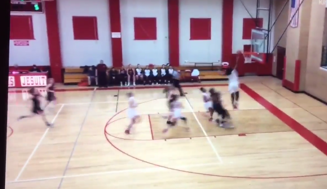 girl dunks in high school game