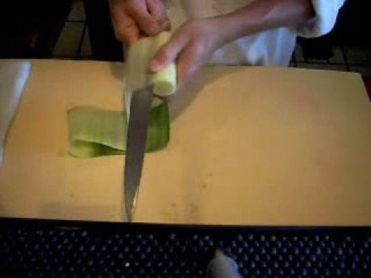 Japanese chef demonstrating knife skills
