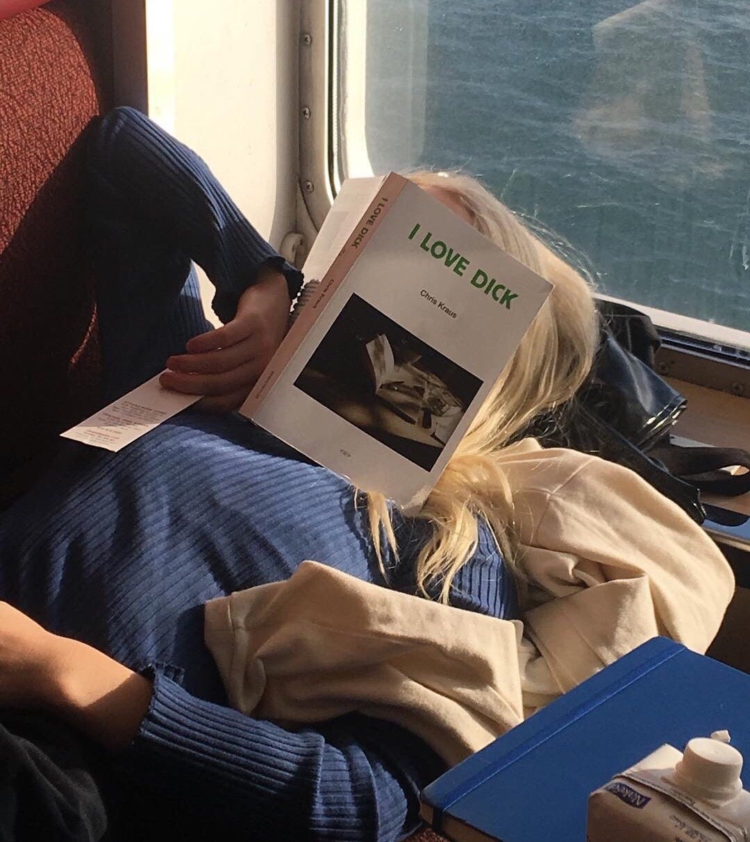 Girl reading a book by philip dick