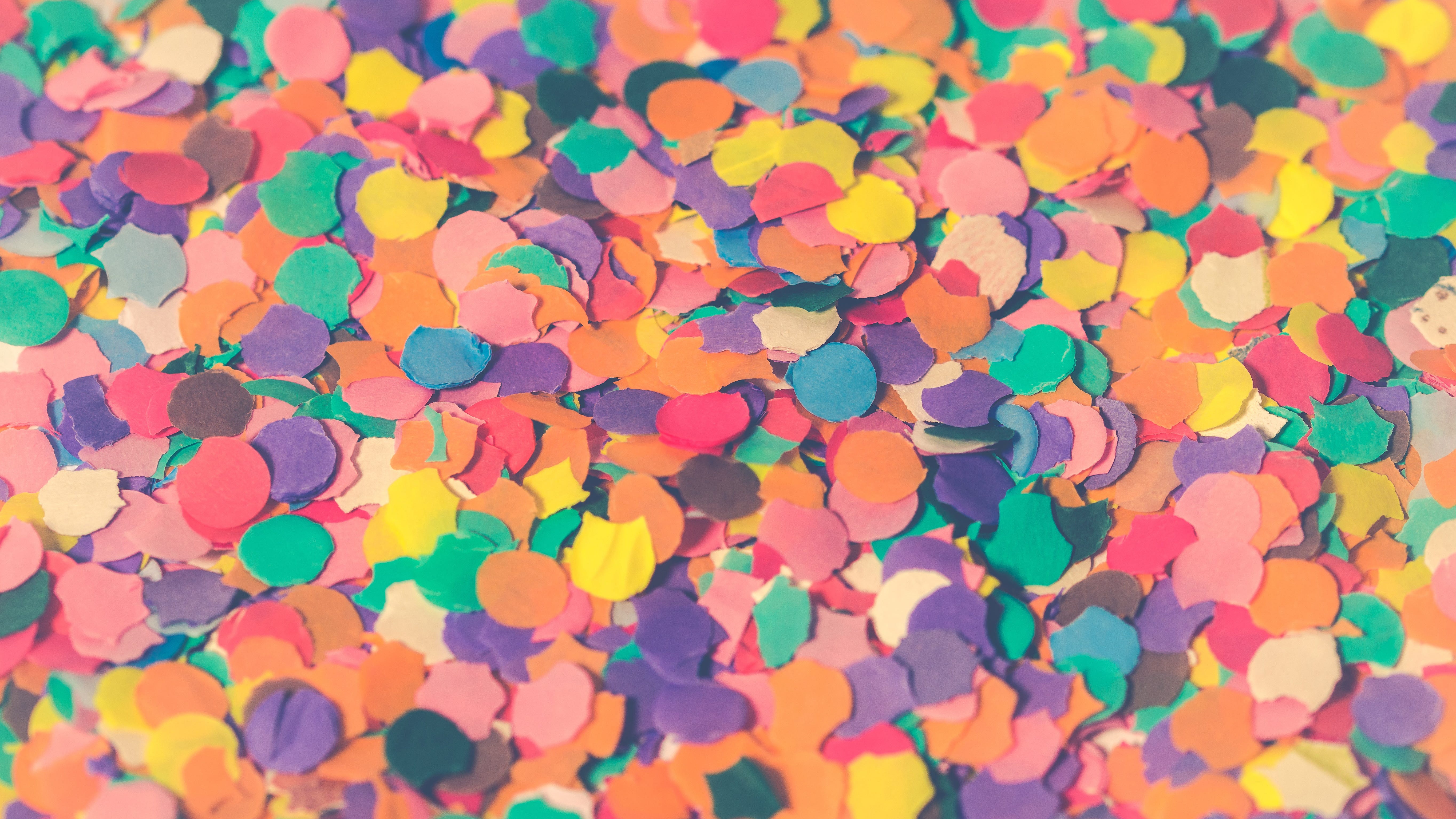 A pile of multi-colored paper confetti circles.