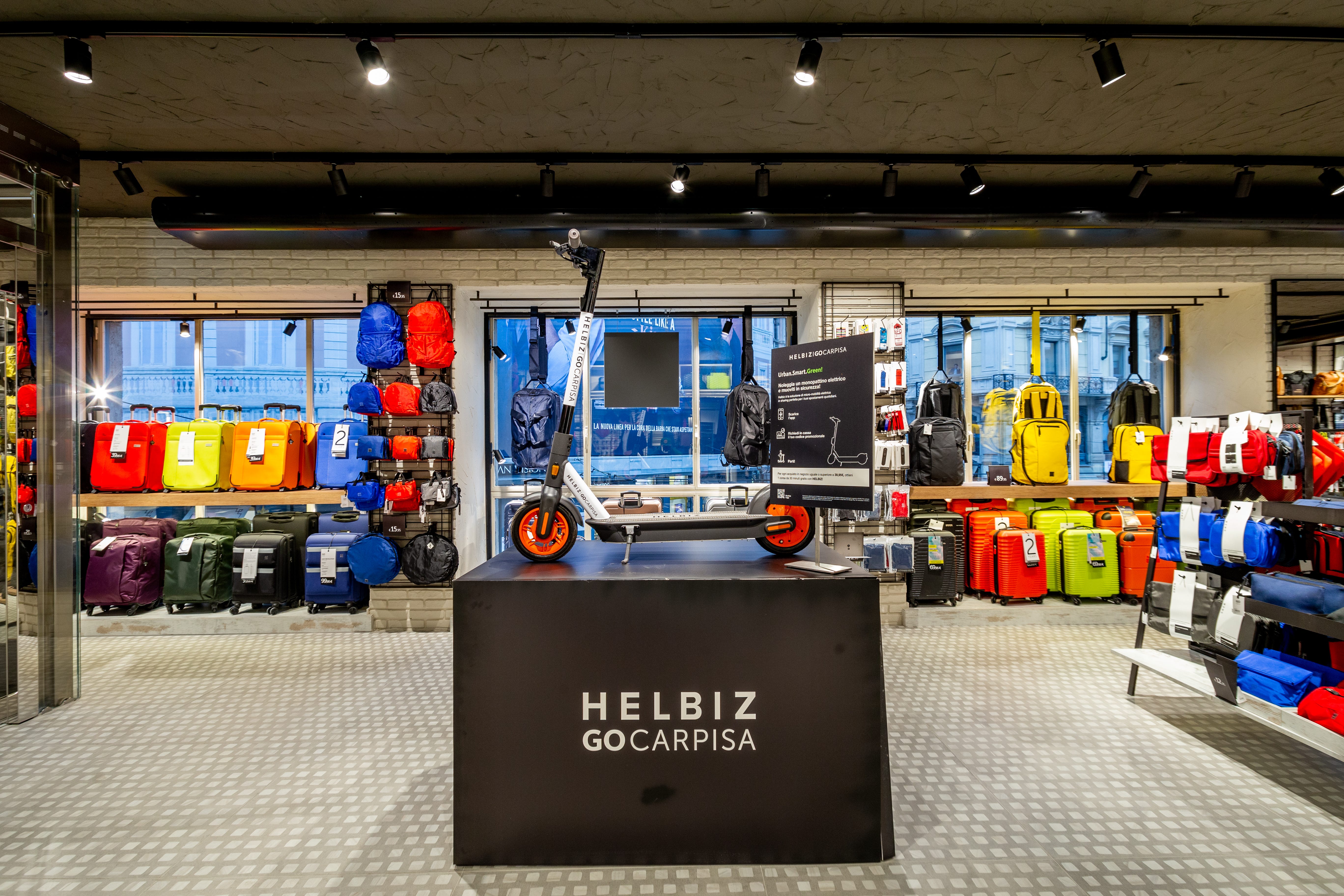 CARPISA e GO CARPISA inaugurano un nuovo megastore in Piazza Cordusio a  Milano e annunciano una partnership con HELBIZ pioniere in Italia per la  micro-mobilità | by Matteo Fioribello | HelbizOfficial