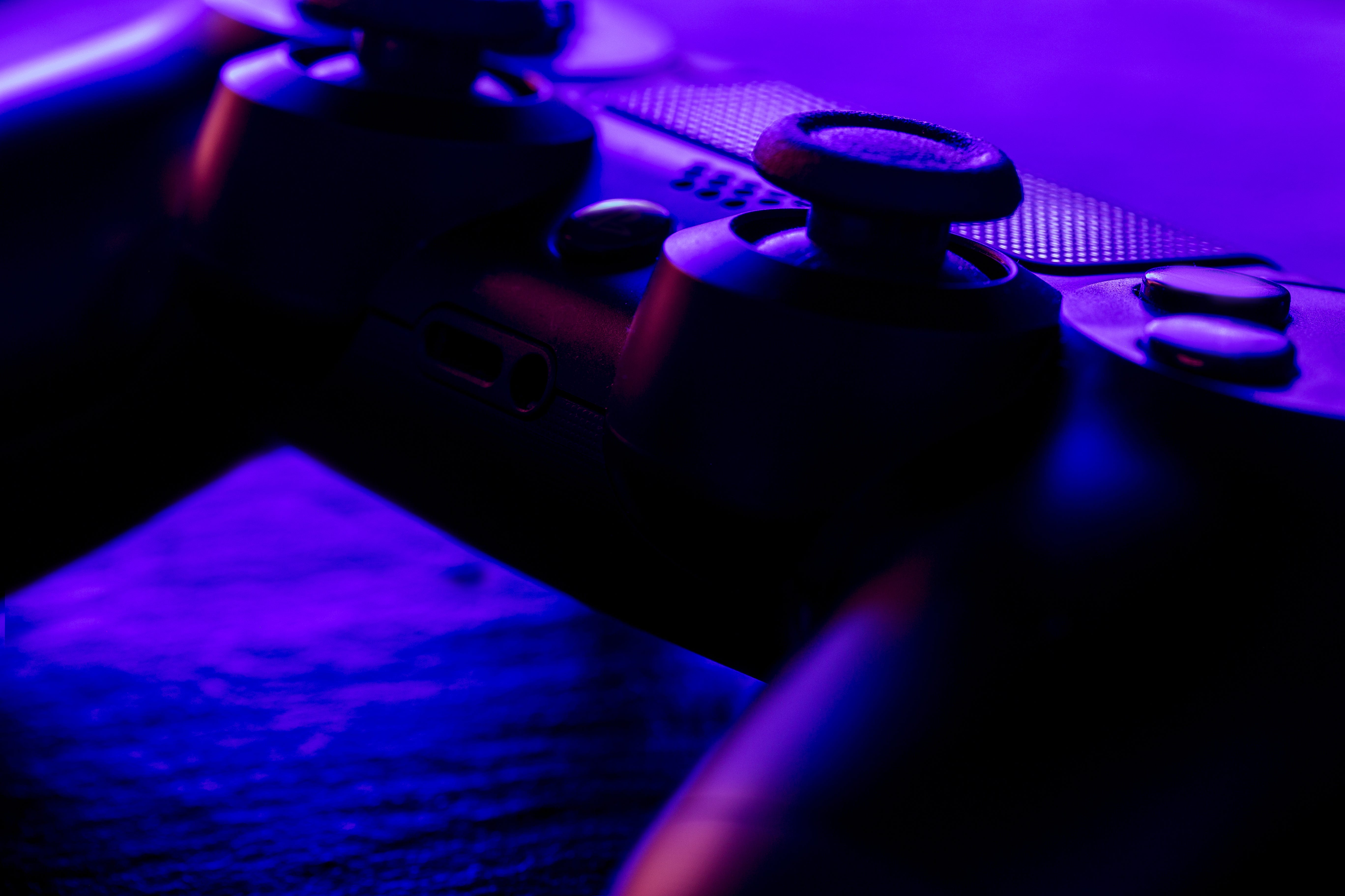 A close up of a game controller on a table.