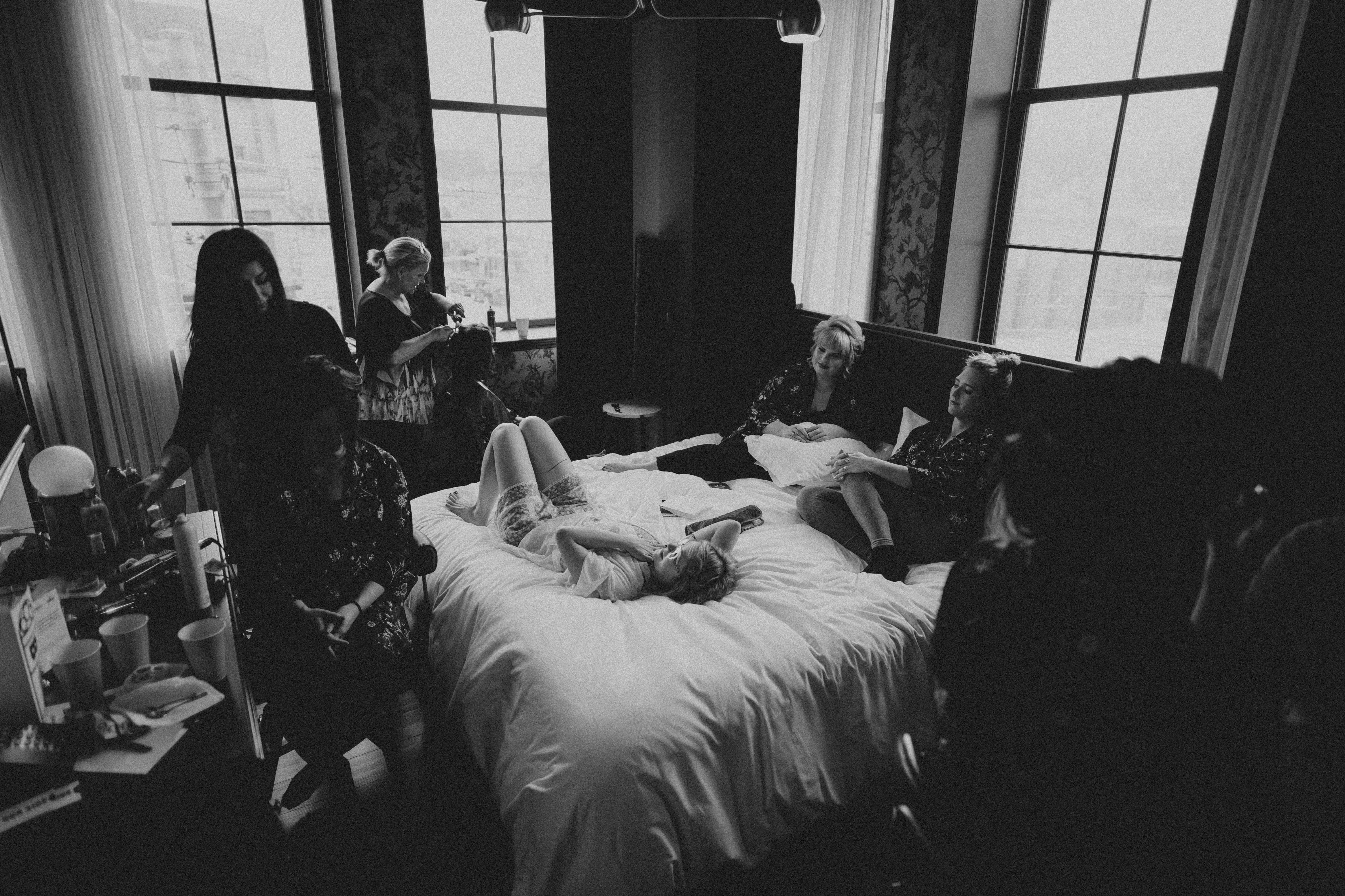 Bridesmaids lounging in a hotel room at the Broadview Hotel