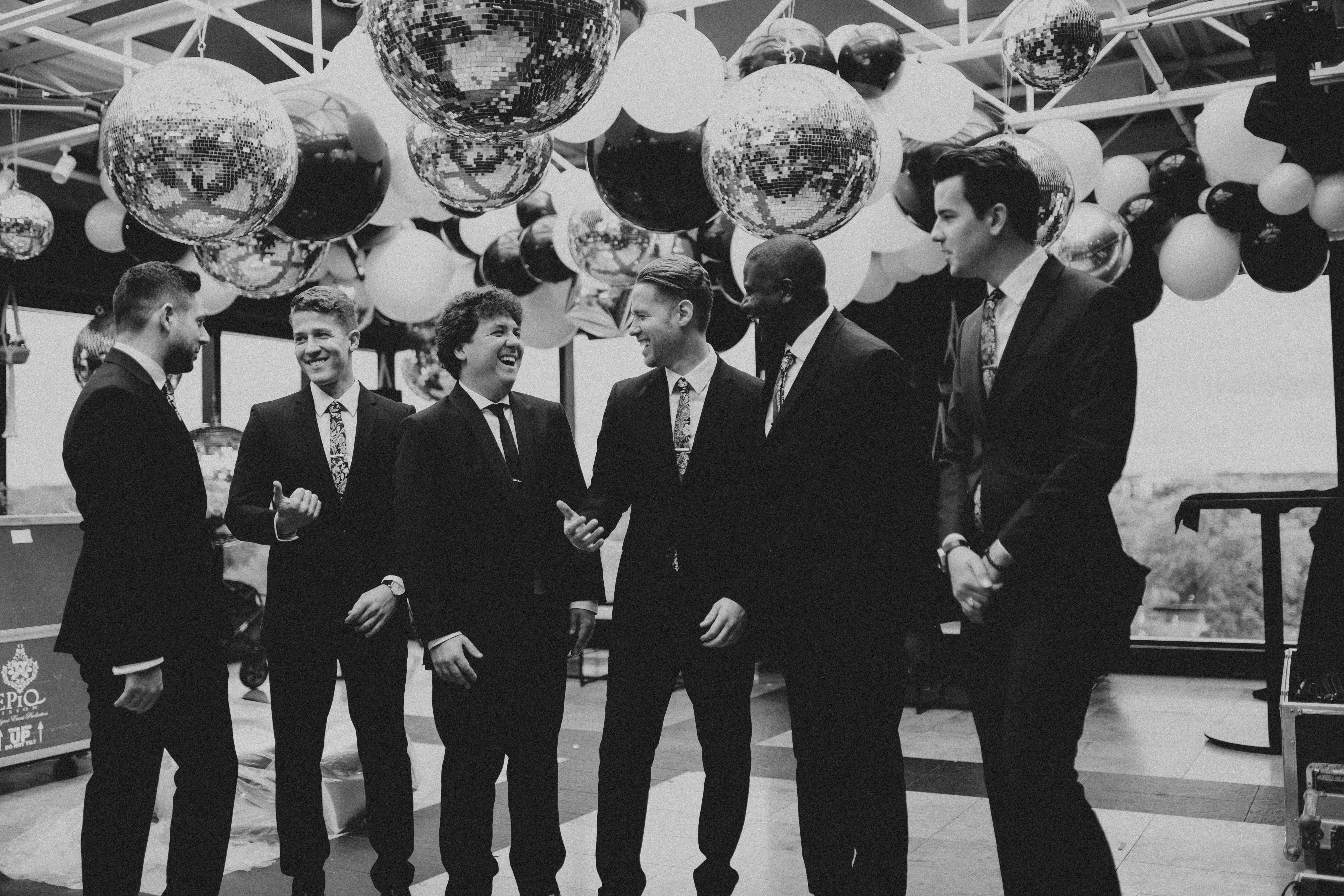 Groomsmen chatting and laughing