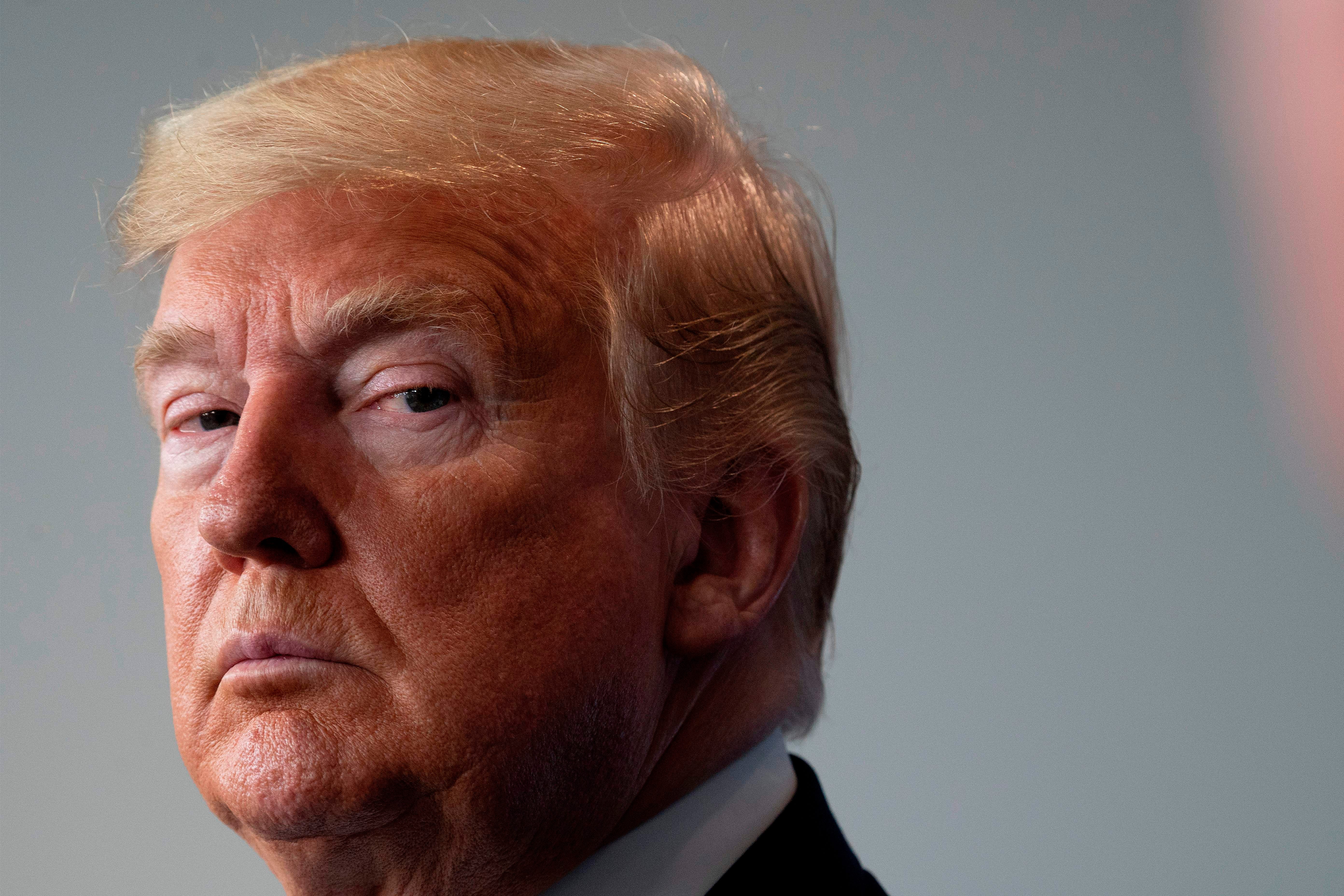 Donald Trump listens during the daily briefing on the novel coronavirus, COVID-19, at the White House on March 21, 2020.