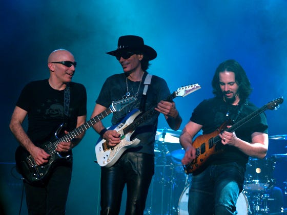 Joe Satriani, Steve Vai, and John Petrucci at a G3 concert