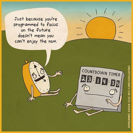 A clock communicating with a countdown timer, saying even you have to enjoy the now even if you are programmed otherwise.