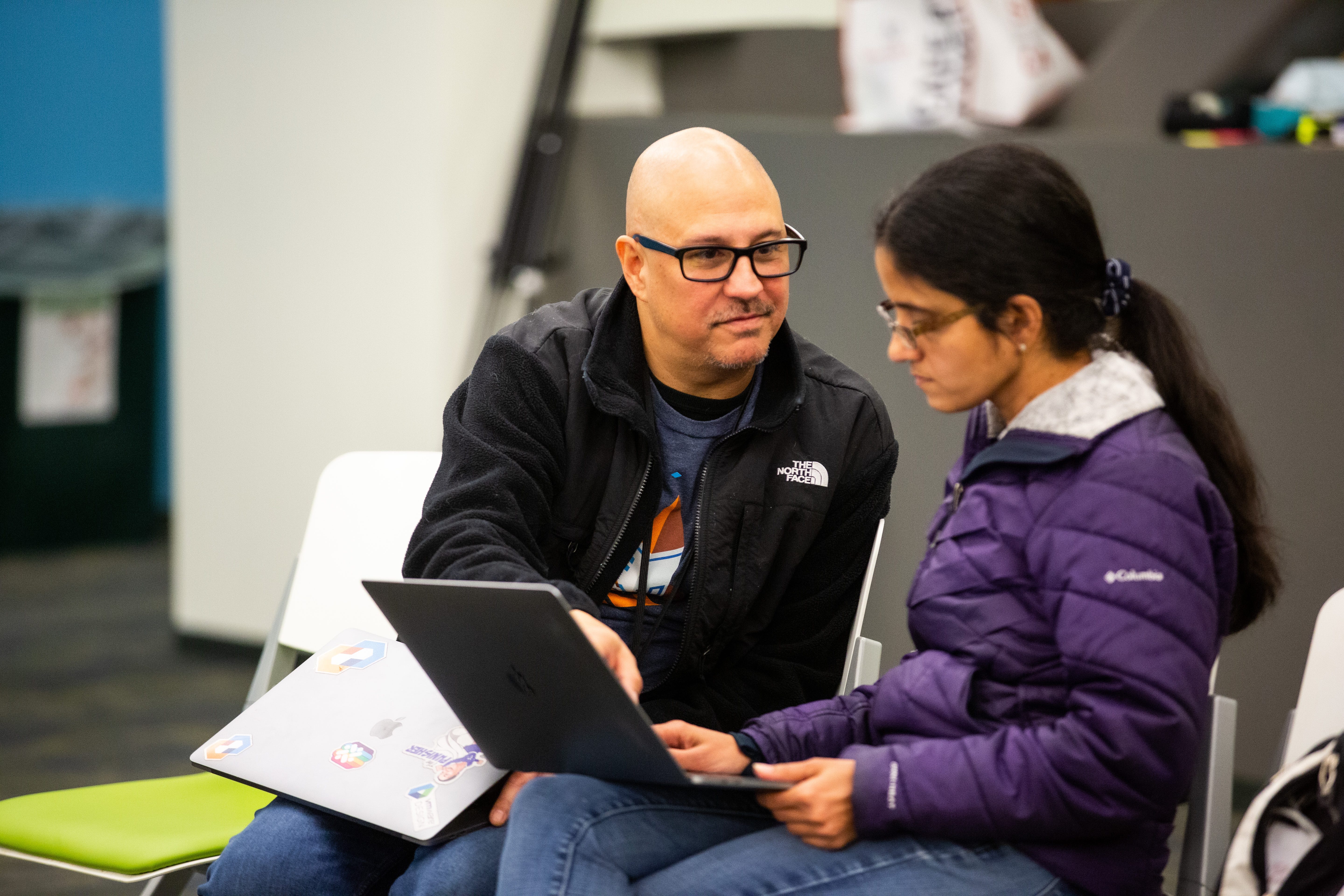 VMware employee Chris Lane at Accessibility Hackathon showing UI developer X how to code in ARIA