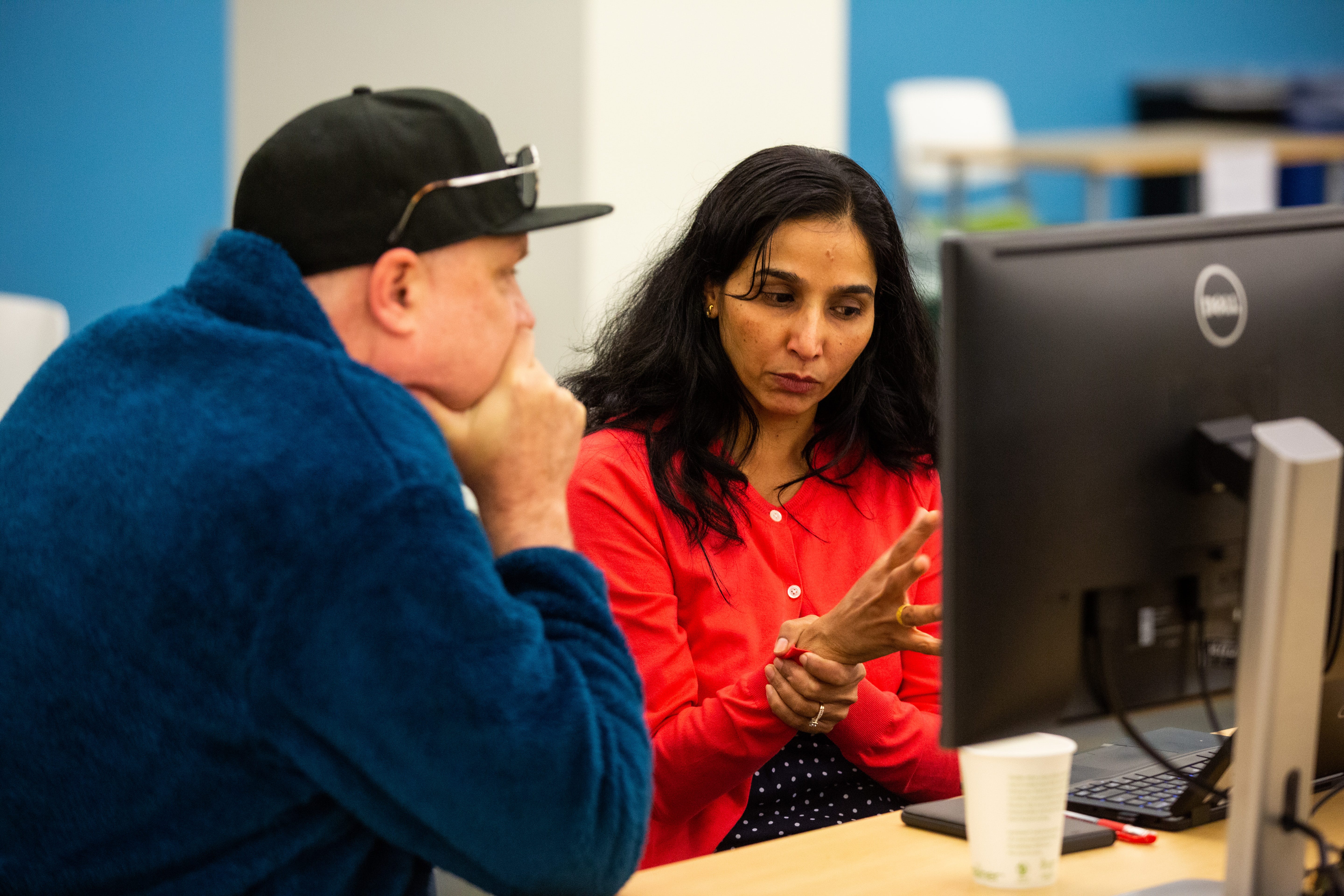 Two people discussing a hackathon idea