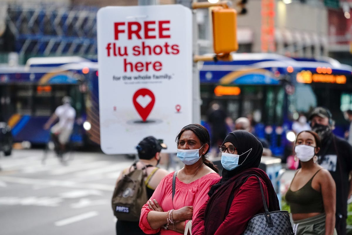 An advertisement offering free flu shots in New York City in August.