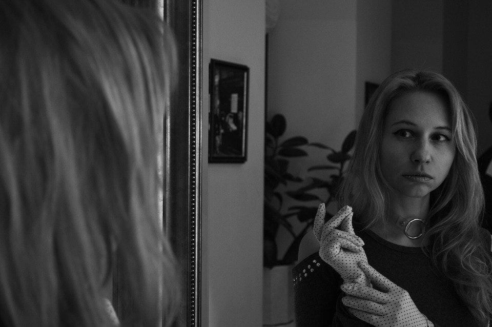 girl looking in mirror