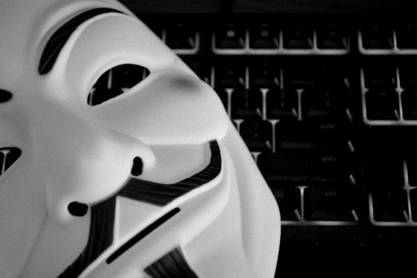 A Guy Fawkes mask on a keyboard