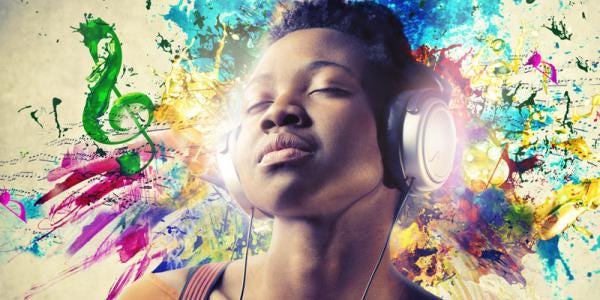 Person listening to music with headphones.