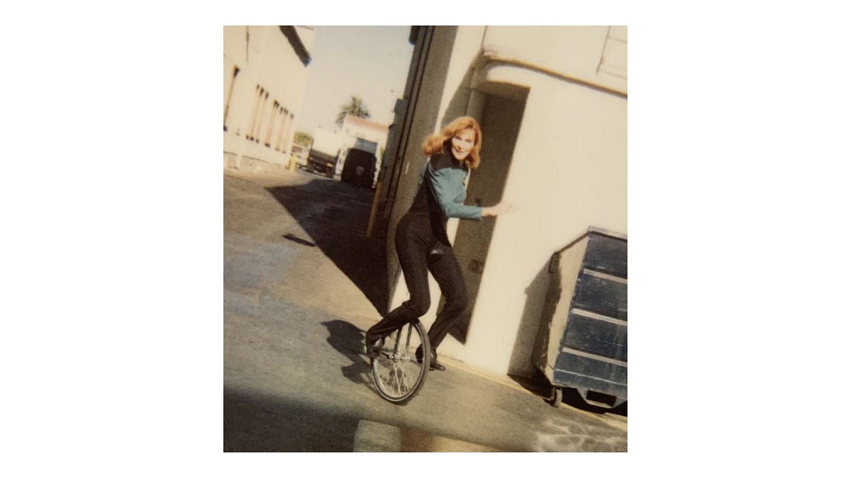 I think this photo of Gates McFadden riding a unicycle ...