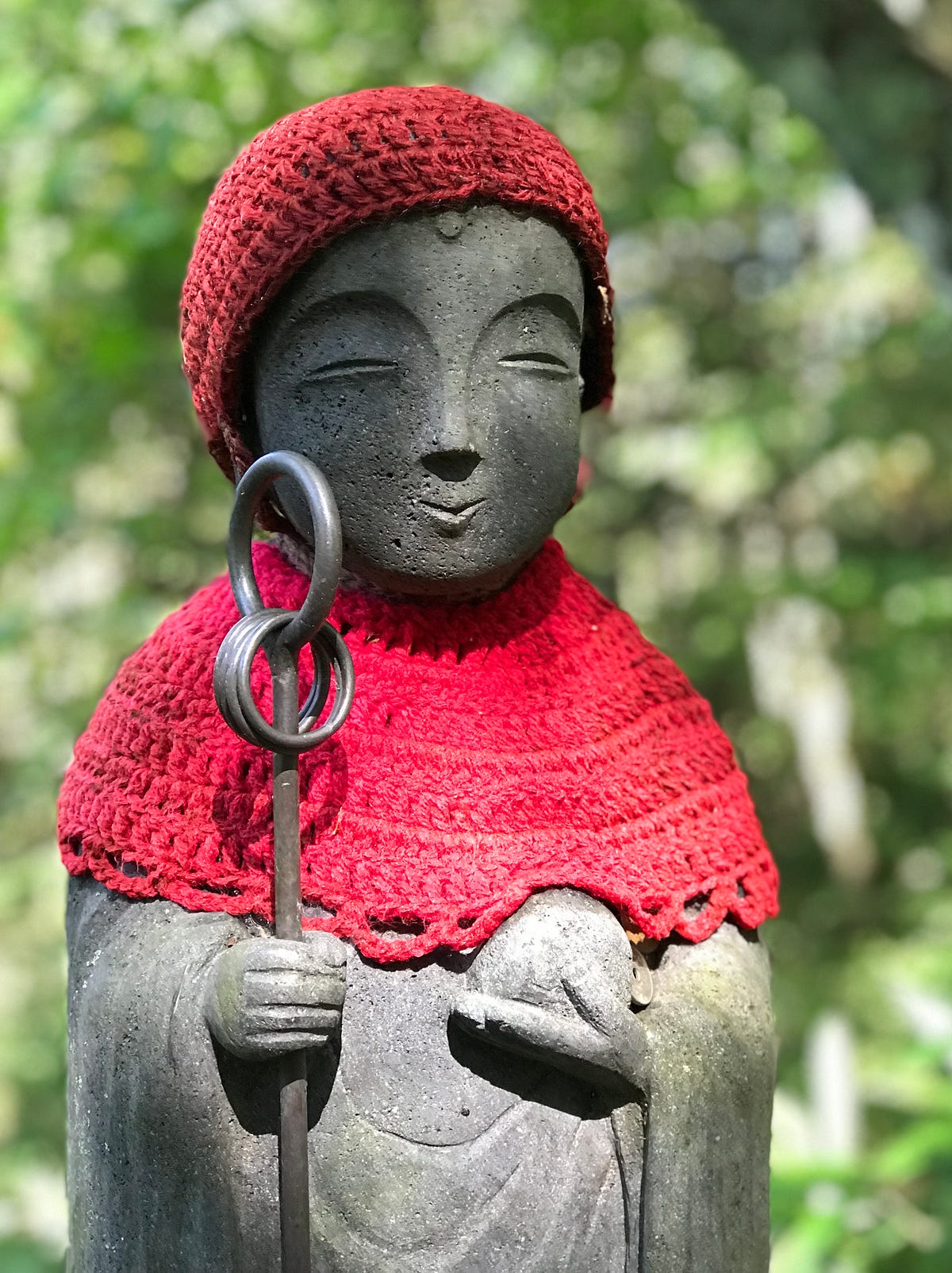 Who is Jizō, and why the bib?. Along the old highways of Japan, you