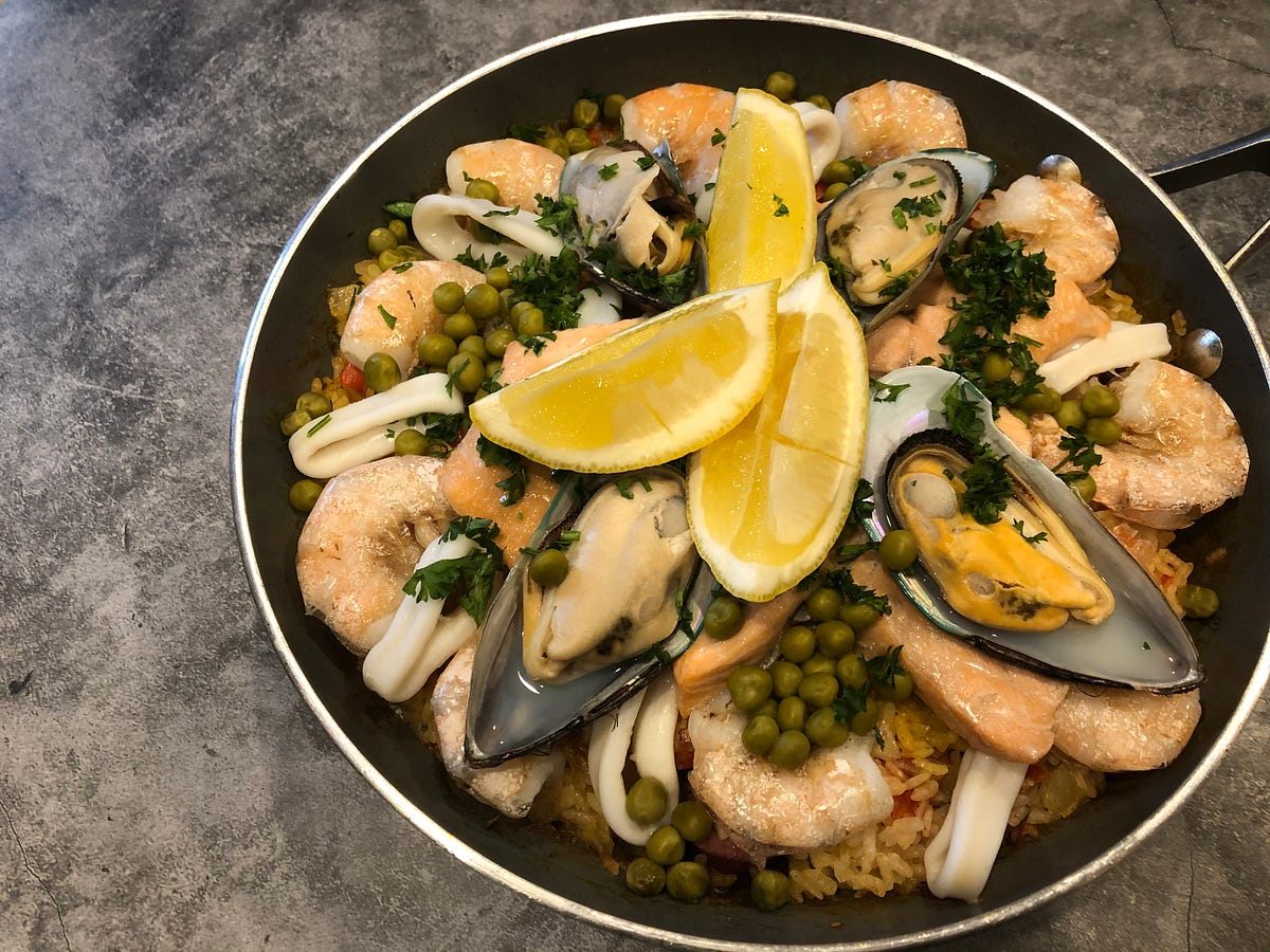 Paella is a Spanish food that has plenty kind of seafood combined with