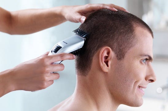 using clippers to trim hair