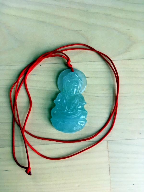 Jade amulet of Guanyin given to the author by his wife for protection