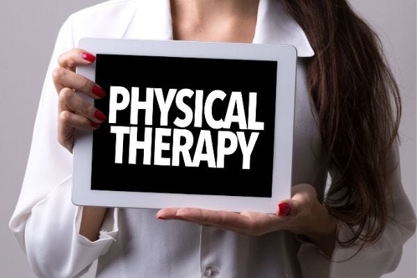Decorative banner image of a person in medical attire holding up a sign that says ‘Physical Therapy’.
