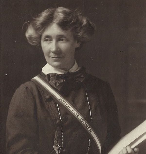 Edith Craig with 'votes for women' sash