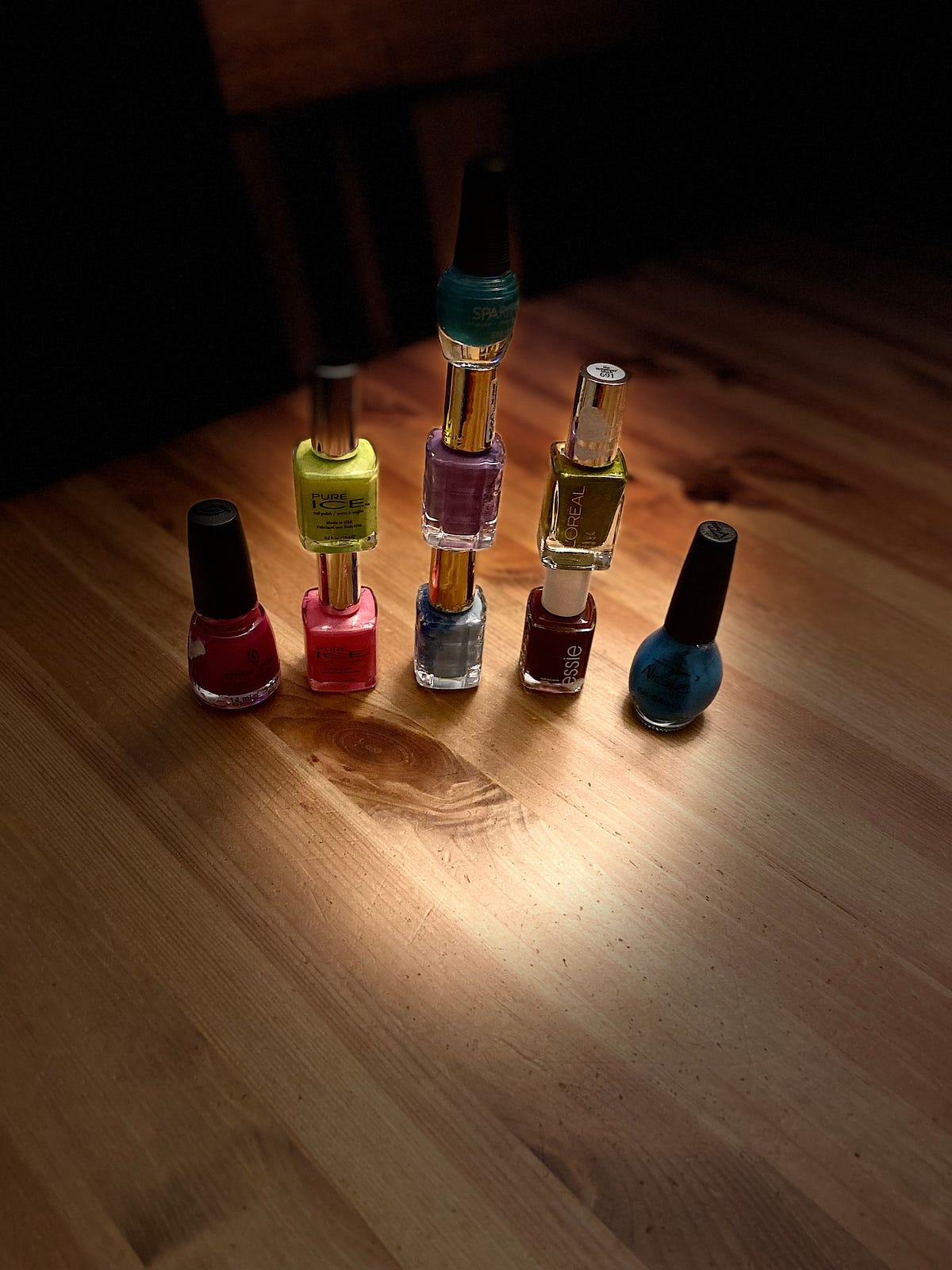 Nine Bottles of Nail Polish. October Six Word Photo Story Challenge… by Mary Chang Story