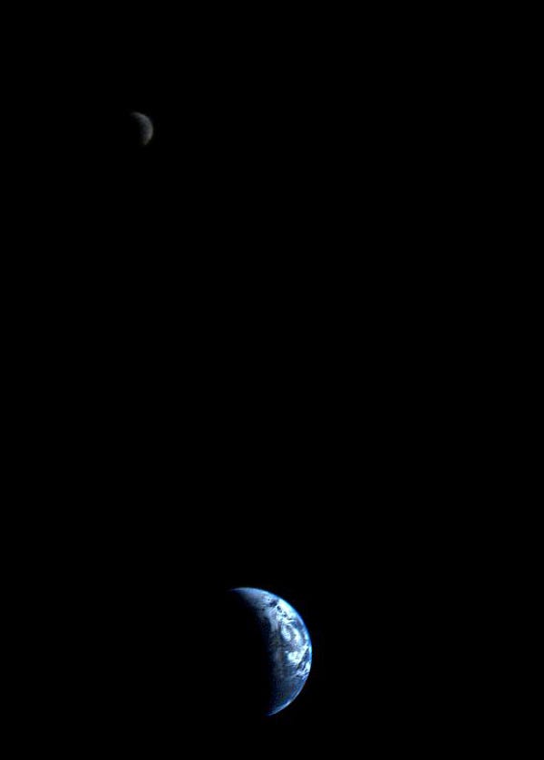 Real photo of Crescent-shaped Earth and Moon taken by Voyager 1 in 1977