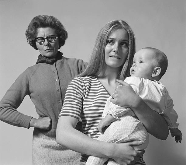 An inquisitive and angry mother-in-law taking her stand.
