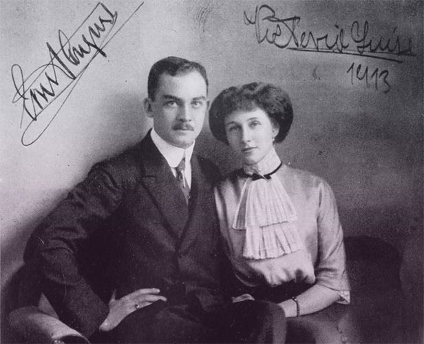 Ernst August in a dark suit and Viktoria Luise in a white blouse with layered cravat.
