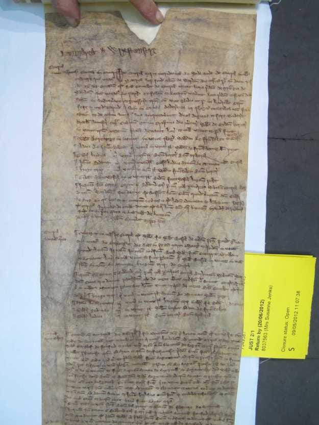 Parchment with brown script in three paragraphs.