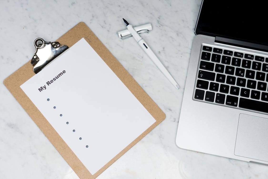 Image of a clipboard and laptop