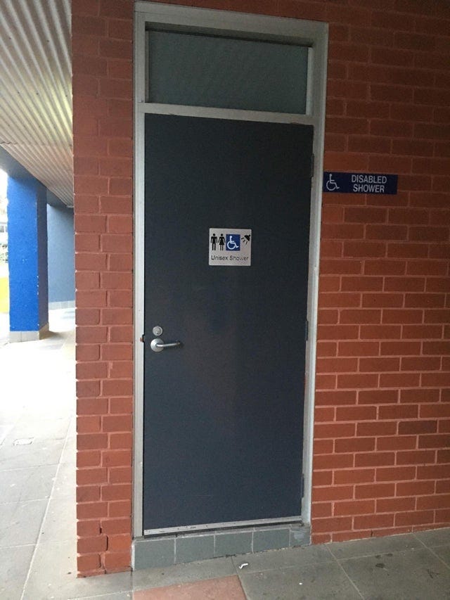 A disabled toilet and shower with a step :(