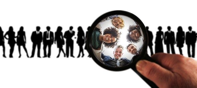 magnifying glass focused on a group of people